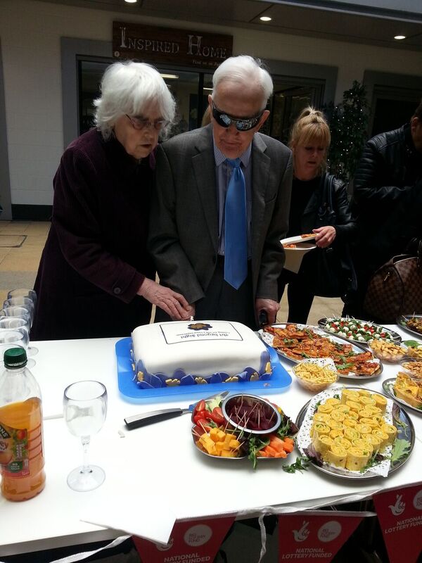 ray feakes cuts the cake